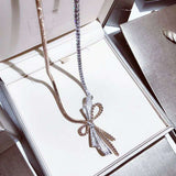 Two-color bow necklace