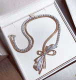 Two-color bow necklace