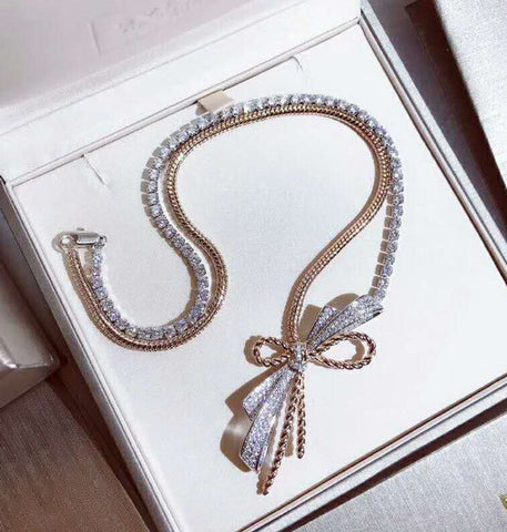 Two-color bow necklace